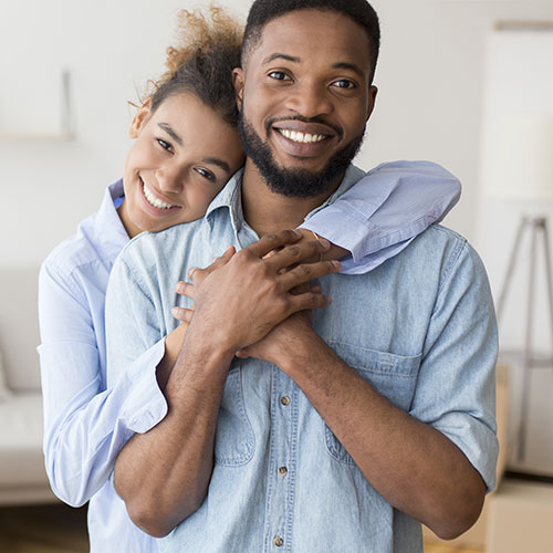 Smiling Couple after teeth whitening at Dentist in Brampton