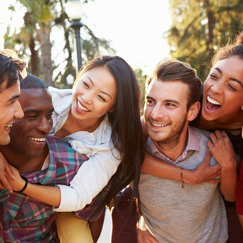 happy group of friend outside at brampton