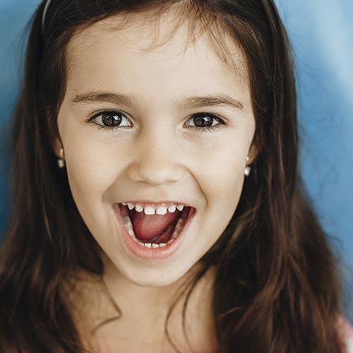 little girl smiling after dental checkup with dentist in brampton